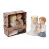 Two ceramic figurines holding hands with 'Close to My Heart' packaging.